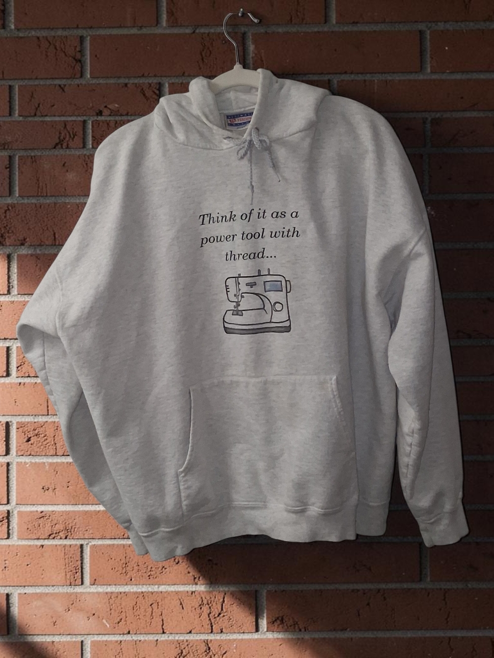 Hanes Light Gray Graphic Crewneck Hoodie with Sewing Machine Quote